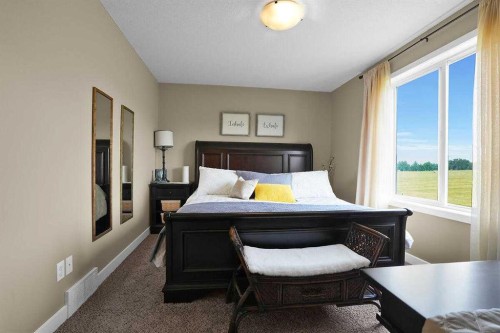 460 Seclusion Valley Drive, Diamond Valley, AB - Indoor Photo Showing Bedroom