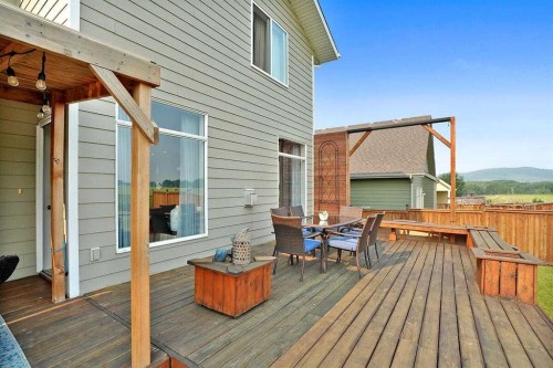 460 Seclusion Valley Drive, Diamond Valley, AB - Outdoor With Deck Patio Veranda With Exterior