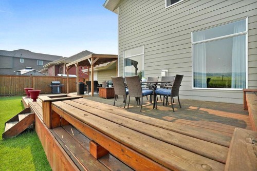460 Seclusion Valley Drive, Diamond Valley, AB - Outdoor With Deck Patio Veranda With Exterior