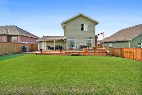 460 Seclusion Valley Drive, Diamond Valley, AB - Outdoor With Deck Patio Veranda With Backyard