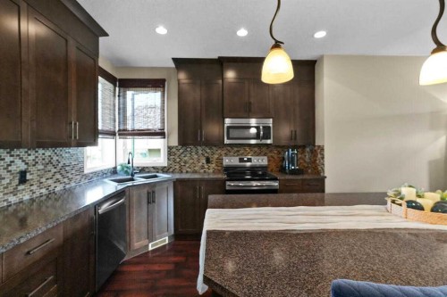 460 Seclusion Valley Drive, Diamond Valley, AB - Indoor Photo Showing Kitchen With Double Sink With Upgraded Kitchen