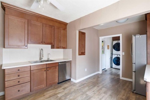 432 Centre Avenue Ne, Airdrie, AB - Indoor Photo Showing Kitchen With Double Sink