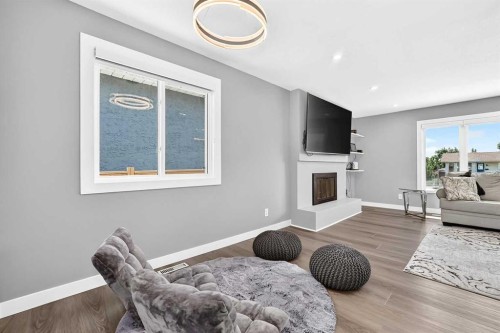 4932 Rundlehorn Drive Ne, Calgary, AB - Indoor Photo Showing Living Room With Fireplace