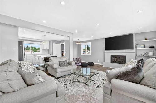 4932 Rundlehorn Drive Ne, Calgary, AB - Indoor Photo Showing Living Room With Fireplace