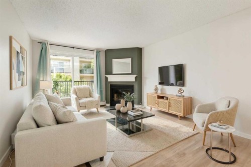 4203-385 Patterson Hill Sw, Calgary, AB - Indoor Photo Showing Living Room With Fireplace