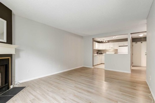 4203-385 Patterson Hill Sw, Calgary, AB - Indoor With Fireplace