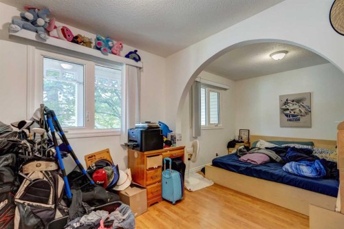 202 Olympia Drive Se, Calgary, AB - Indoor Photo Showing Bedroom