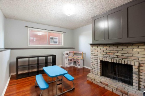 235 Templemont Drive Ne, Calgary, AB - Indoor Photo Showing Living Room With Fireplace