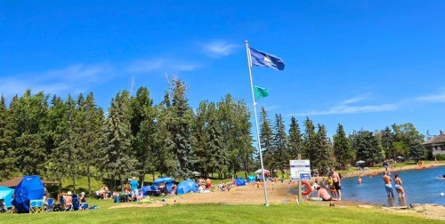 76 Sunlake Gardens Se, Calgary, AB - Outdoor With Body Of Water