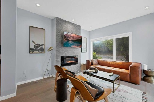 3306 2 Street Ne, Calgary, AB - Indoor Photo Showing Living Room With Fireplace