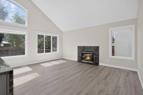 340 Copperfield Boulevard Se, Calgary, AB - Indoor Photo Showing Living Room With Fireplace