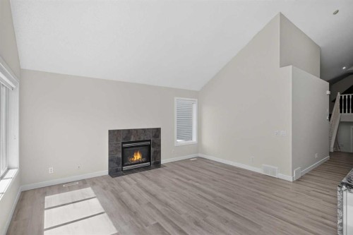 340 Copperfield Boulevard Se, Calgary, AB - Indoor Photo Showing Living Room With Fireplace
