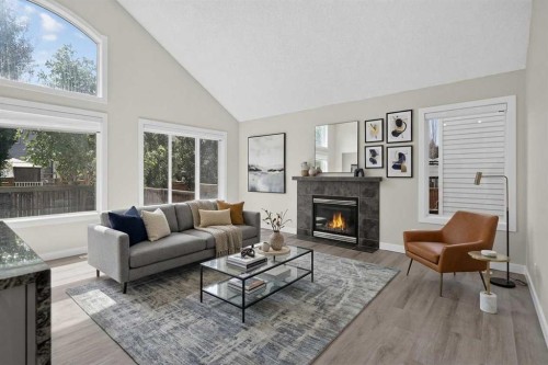 340 Copperfield Boulevard Se, Calgary, AB - Indoor Photo Showing Living Room With Fireplace