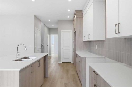 37 Rosemary Gardens Se, Calgary, AB - Indoor Photo Showing Kitchen With Double Sink