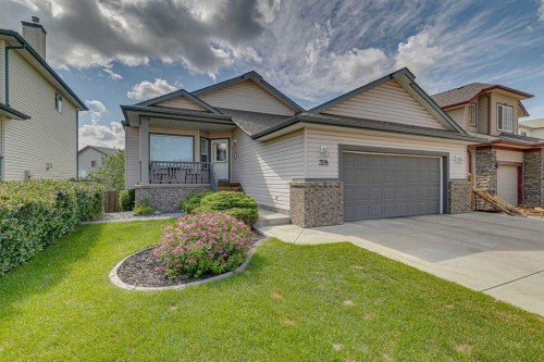 328 Cove Road, Chestermere, AB - Outdoor With Deck Patio Veranda With Facade