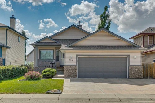 328 Cove Road, Chestermere, AB - Outdoor With Facade