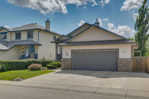328 Cove Road, Chestermere, AB - Outdoor With Facade
