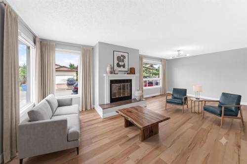 28 Whiteram Close Ne, Calgary, AB - Indoor Photo Showing Living Room With Fireplace