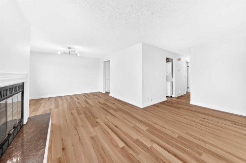 28 Whiteram Close Ne, Calgary, AB - Indoor Photo Showing Other Room With Fireplace