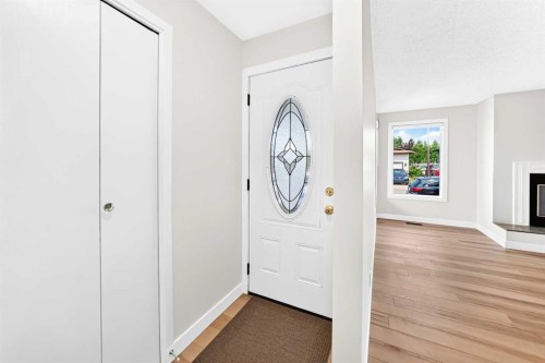 28 Whiteram Close Ne, Calgary, AB - Indoor Photo Showing Other Room With Fireplace