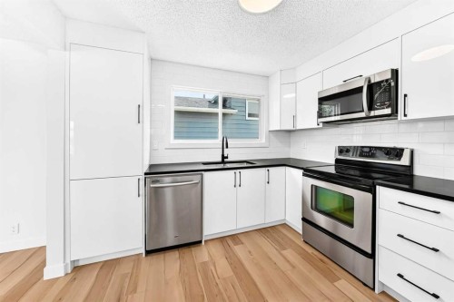 28 Whiteram Close Ne, Calgary, AB - Indoor Photo Showing Kitchen With Double Sink With Upgraded Kitchen