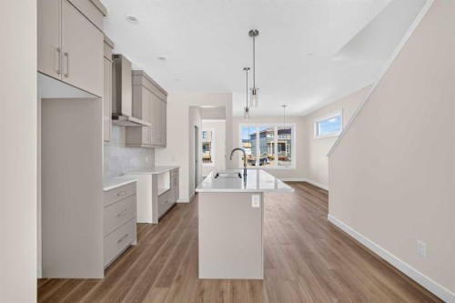 138 Starling Boulevard Nw, Calgary, AB - Indoor Photo Showing Kitchen With Upgraded Kitchen