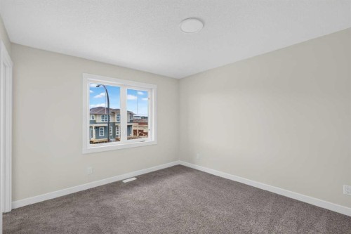 138 Starling Boulevard Nw, Calgary, AB - Indoor Photo Showing Other Room