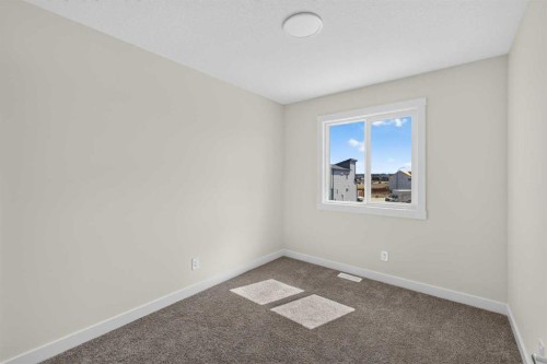 138 Starling Boulevard Nw, Calgary, AB - Indoor Photo Showing Other Room