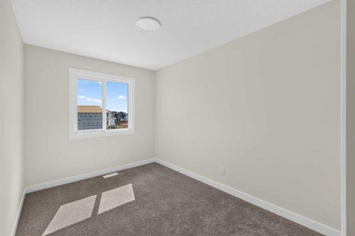 138 Starling Boulevard Nw, Calgary, AB - Indoor Photo Showing Other Room