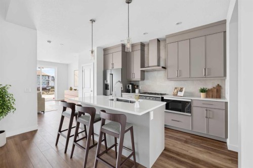138 Starling Boulevard Nw, Calgary, AB - Indoor Photo Showing Kitchen With Upgraded Kitchen