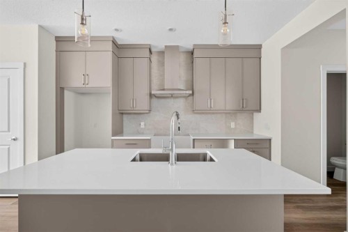 138 Starling Boulevard Nw, Calgary, AB - Indoor Photo Showing Kitchen With Upgraded Kitchen