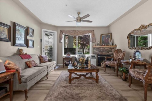 131-369 Rocky Vista Park Nw, Calgary, AB - Indoor Photo Showing Living Room With Fireplace