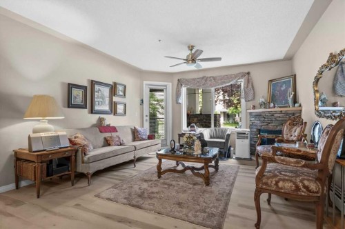 131-369 Rocky Vista Park Nw, Calgary, AB - Indoor Photo Showing Living Room With Fireplace