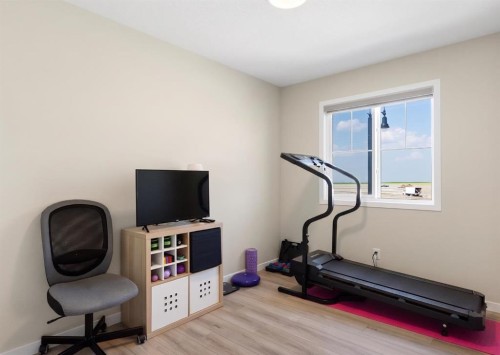 239 Vista Road, Crossfield, AB - Indoor Photo Showing Gym Room