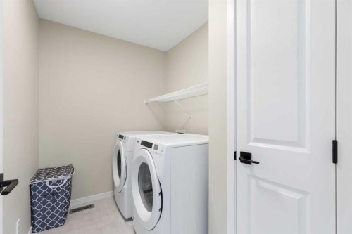 239 Vista Road, Crossfield, AB - Indoor Photo Showing Laundry Room