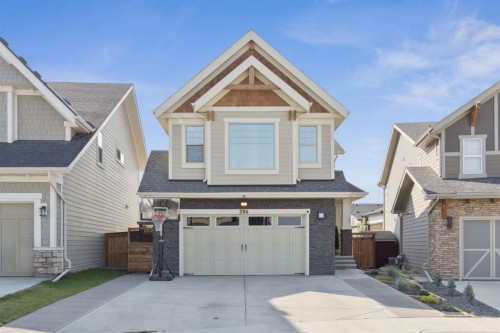206 Riviera View, Cochrane, AB - Outdoor With Facade