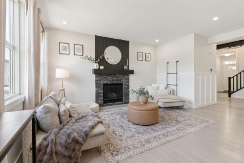 206 Riviera View, Cochrane, AB - Indoor Photo Showing Living Room With Fireplace
