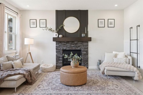 206 Riviera View, Cochrane, AB - Indoor Photo Showing Living Room With Fireplace