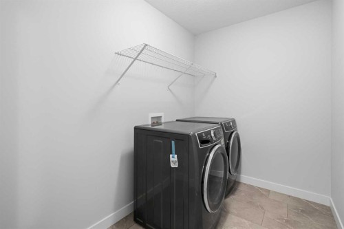 71 Belvedere Green Se, Calgary, AB - Indoor Photo Showing Laundry Room