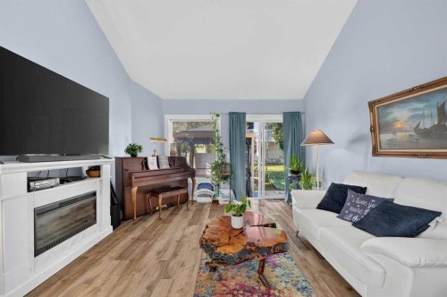 61 Somervale Point Sw, Calgary, AB - Indoor Photo Showing Living Room With Fireplace