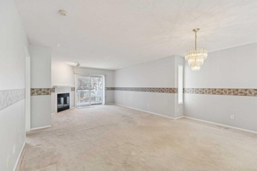 134 Hawkstone Manor Nw, Calgary, AB - Indoor Photo Showing Other Room With Fireplace