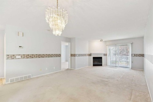 134 Hawkstone Manor Nw, Calgary, AB - Indoor With Fireplace