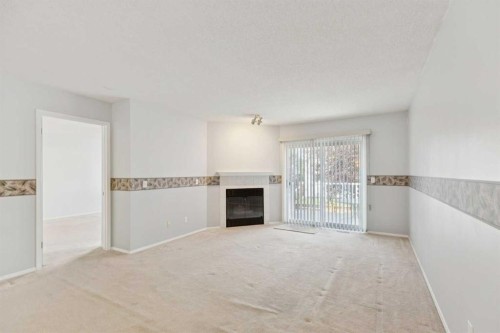 134 Hawkstone Manor Nw, Calgary, AB - Indoor With Fireplace