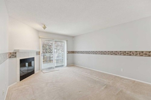 134 Hawkstone Manor Nw, Calgary, AB - Indoor With Fireplace
