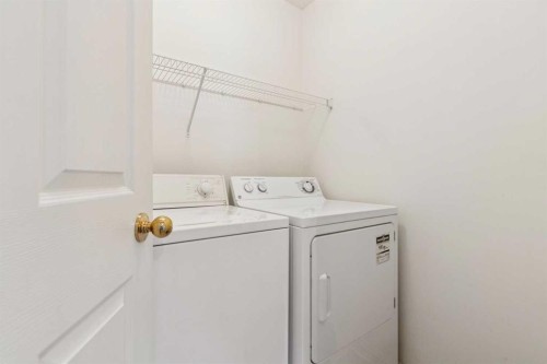 134 Hawkstone Manor Nw, Calgary, AB - Indoor Photo Showing Laundry Room