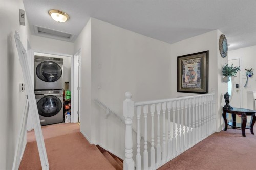 36 Dovista Court Se, Calgary, AB - Indoor Photo Showing Laundry Room