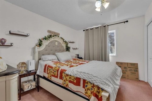 36 Dovista Court Se, Calgary, AB - Indoor Photo Showing Bedroom