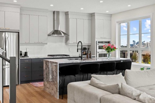 105 Sovereign Common Sw, Calgary, AB - Indoor Photo Showing Kitchen With Upgraded Kitchen