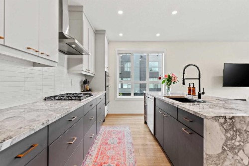 105 Sovereign Common Sw, Calgary, AB - Indoor Photo Showing Kitchen With Upgraded Kitchen