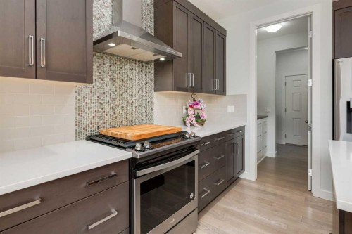 439 Canals Boulevard Sw, Airdrie, AB - Indoor Photo Showing Kitchen With Upgraded Kitchen